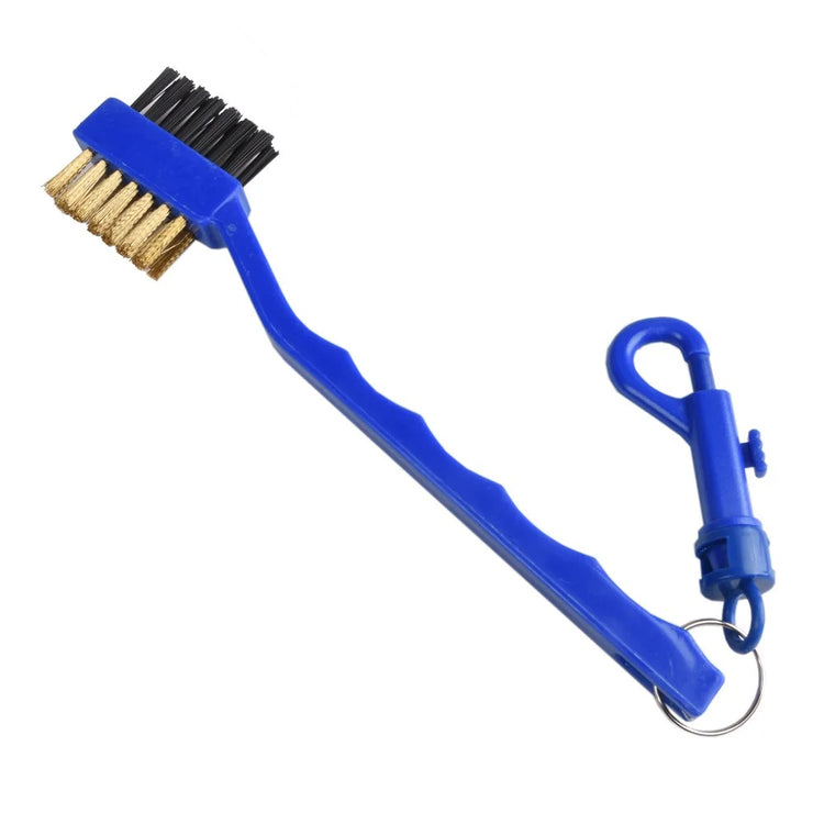 Golf club cleaning brush removing dirt from club face