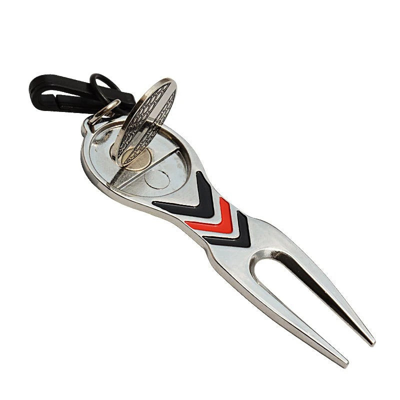 Golf divot repair tool lifting grass on golf course