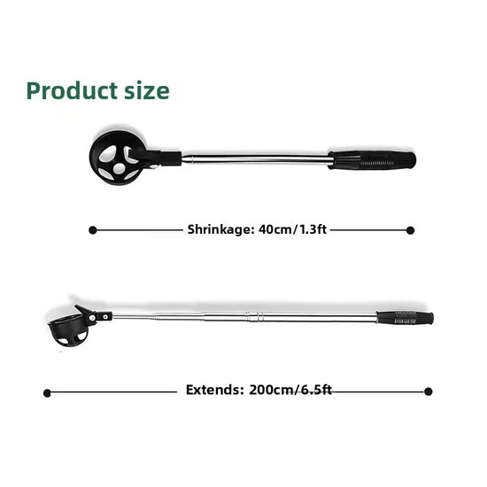 Extendable golf ball retriever tool picking ball from grass on golf course