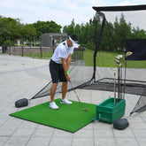 Golf practice mat placed on backyard ground for training